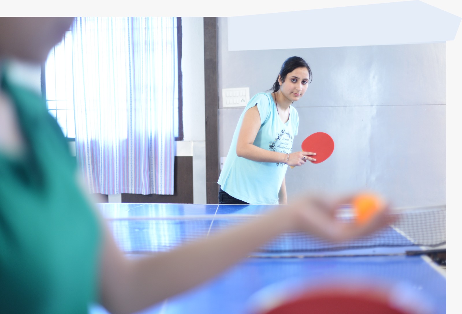 Students playing table tennis