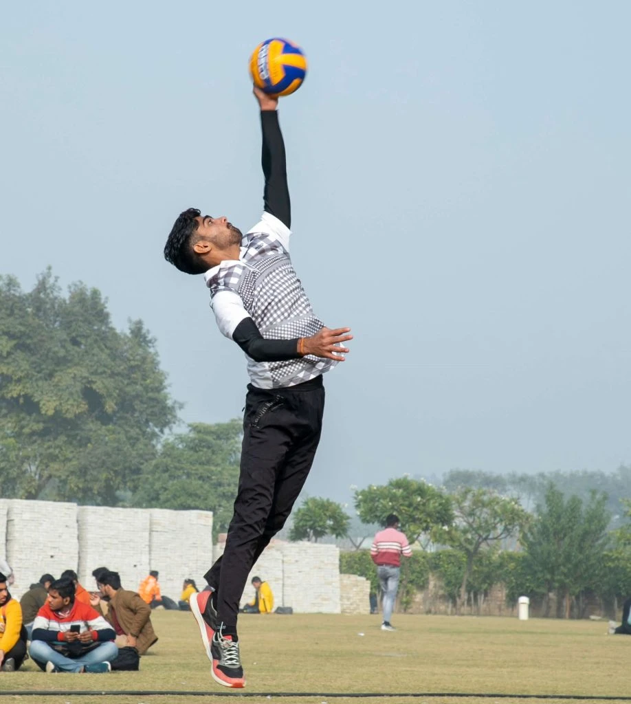 Student playing volleyball